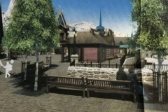 Dorfplatz mit Bänken und Bäumen