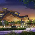 Konzeptzeichnung eines Hotelgebäudes mit einem großen Vordach, unter dem Autos vorfahren können