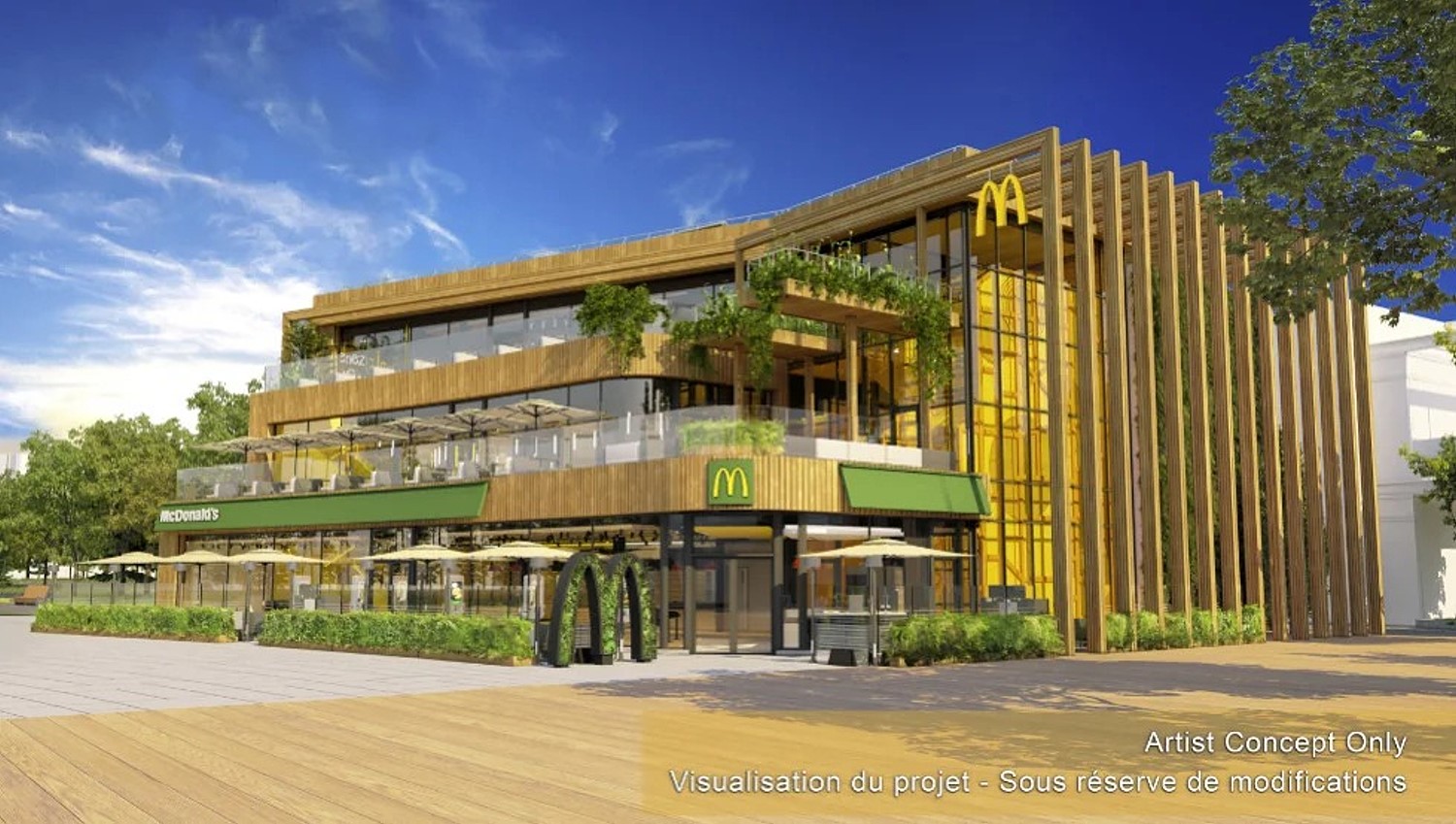 Visualisierung des neuen McDonald’s Gebäudes im Disney Village mit moderner Holzfassade